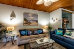 living area, two sofas, beach decor, wall art, ceiling fan, bunk beds, tile floors